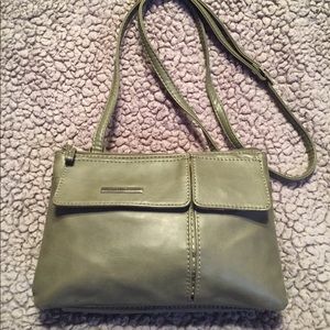 Koltov dark green crossbody purse.